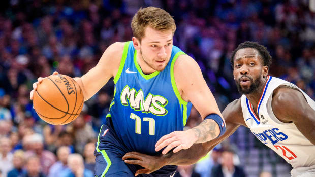 Nov 26, 2019; Dallas, TX, USA; Dallas Mavericks forward Luka Doncic (77) drives to the basket past \LA Clippers guard Patrick Beverley (21) during the first quarter at the American Airlines Center. Mandatory Credit: Jerome Miron-USA TODAY Sports